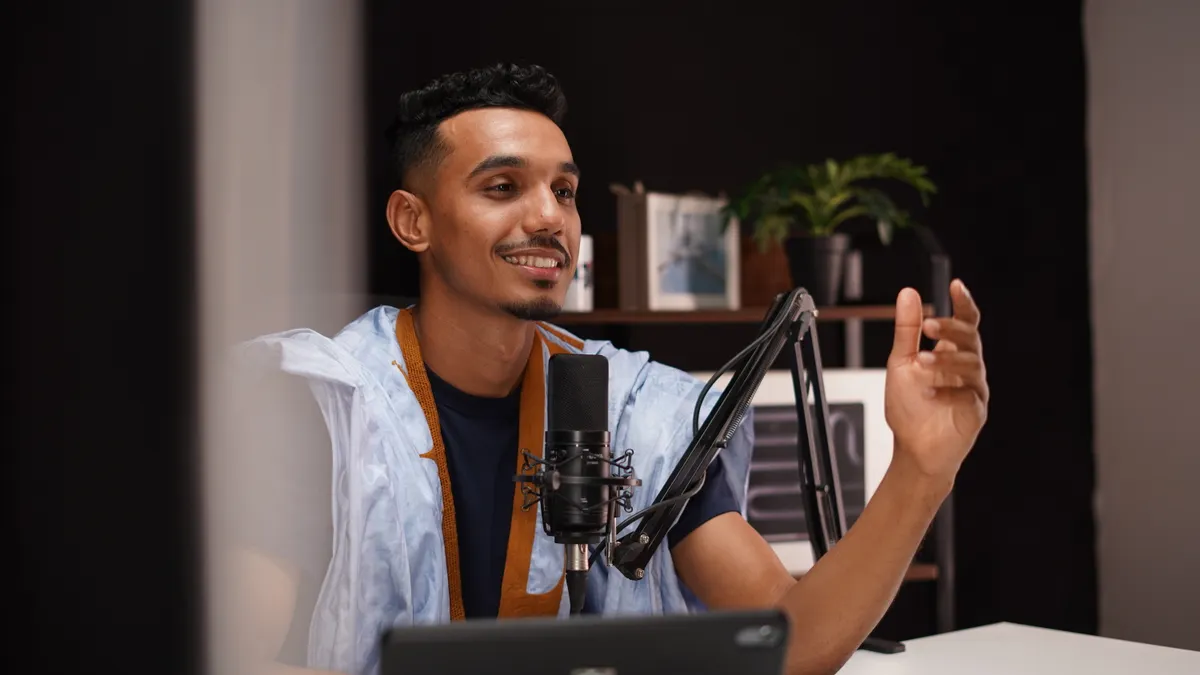 How to Get Links from Podcasts, Interviews, and Media Features — Young Man Podcasting in Home Studio Setting